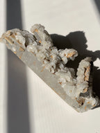 Beautiful flower calcite specimen with quartz inclusions, showcasing natural textures and colors.