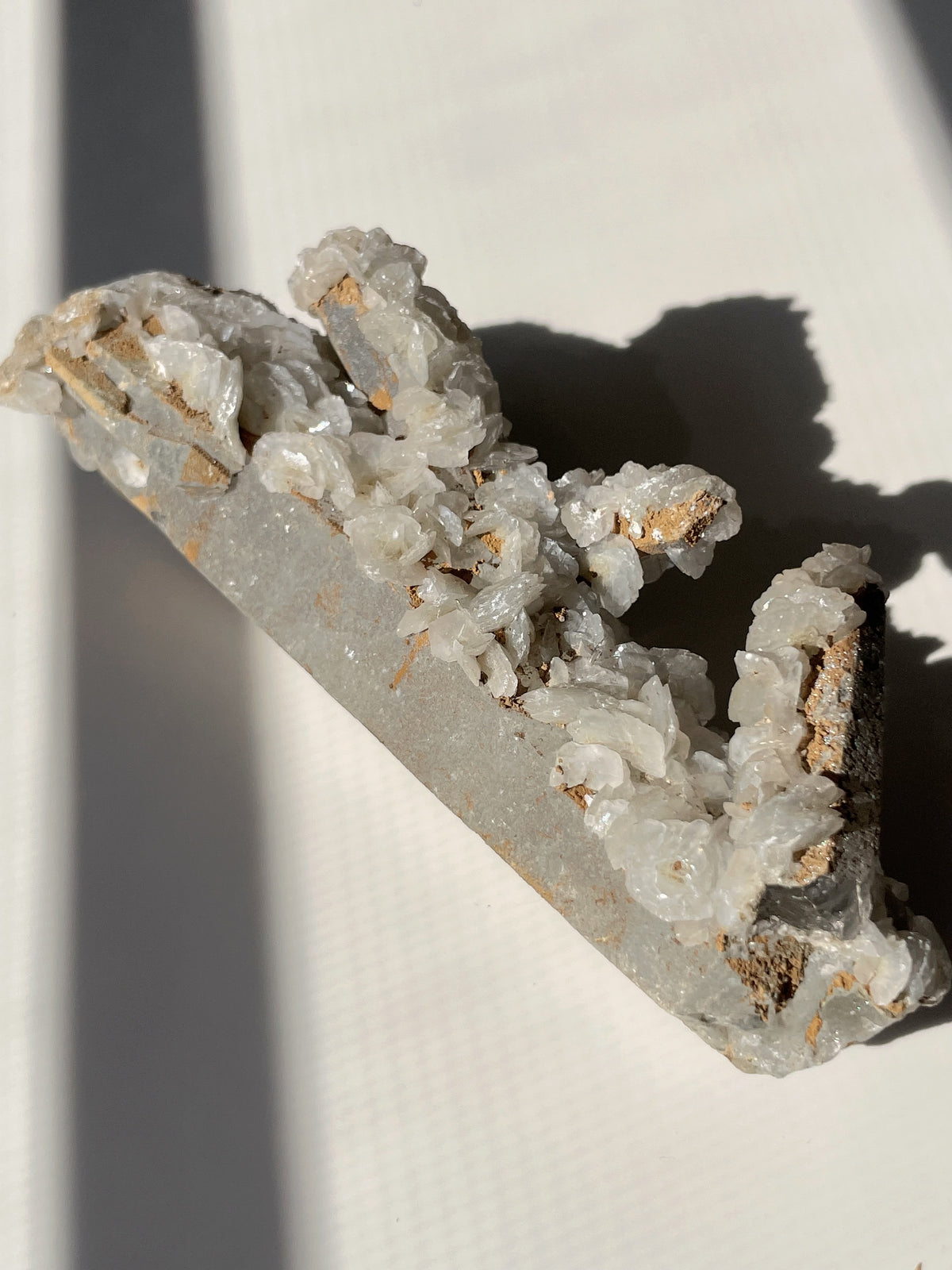 Beautiful flower calcite specimen with quartz inclusions, showcasing natural textures and colors.
