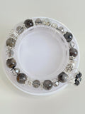 Beautiful quartz bracelet featuring 9.5mm beads with silver accents, displayed on a white background.