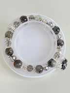 Beautiful quartz bracelet featuring 9.5mm beads with silver accents, displayed on a white background.
