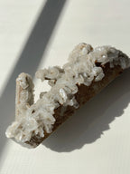Beautiful crystal specimen featuring flower calcite on chlorite-included quartz, showcasing intricate formations and
