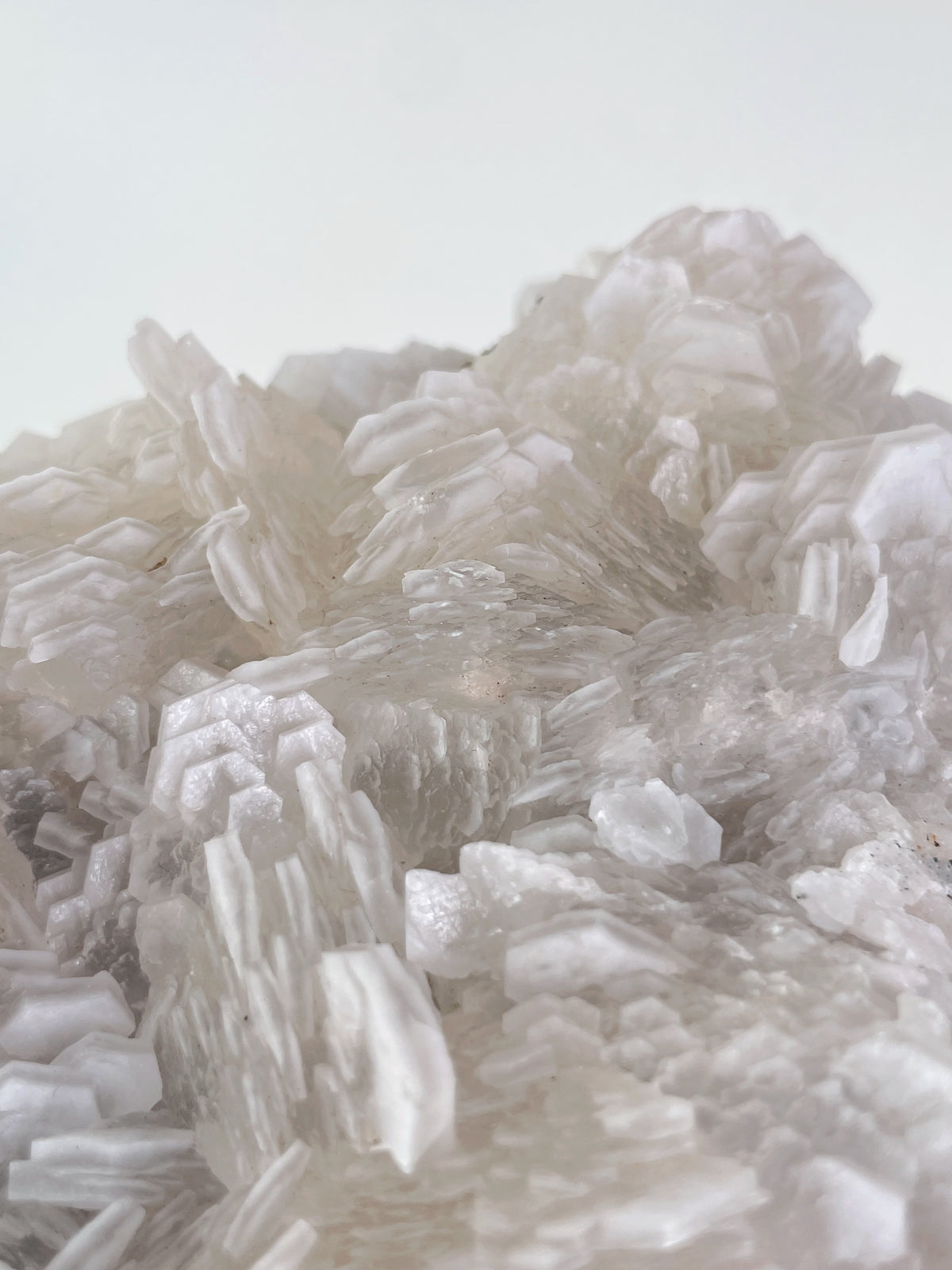 Beautiful biscuit calcite crystal specimen with layered, translucent formations, showcasing natural textures.