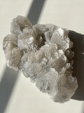 Biscuit calcite specimen with intricate crystal formations, showcasing a beautiful array of textures and colors.