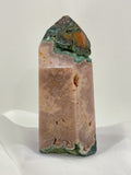 Pink amethyst crystal tower with natural moss agate accents, showcasing beautiful earthy tones and textures.