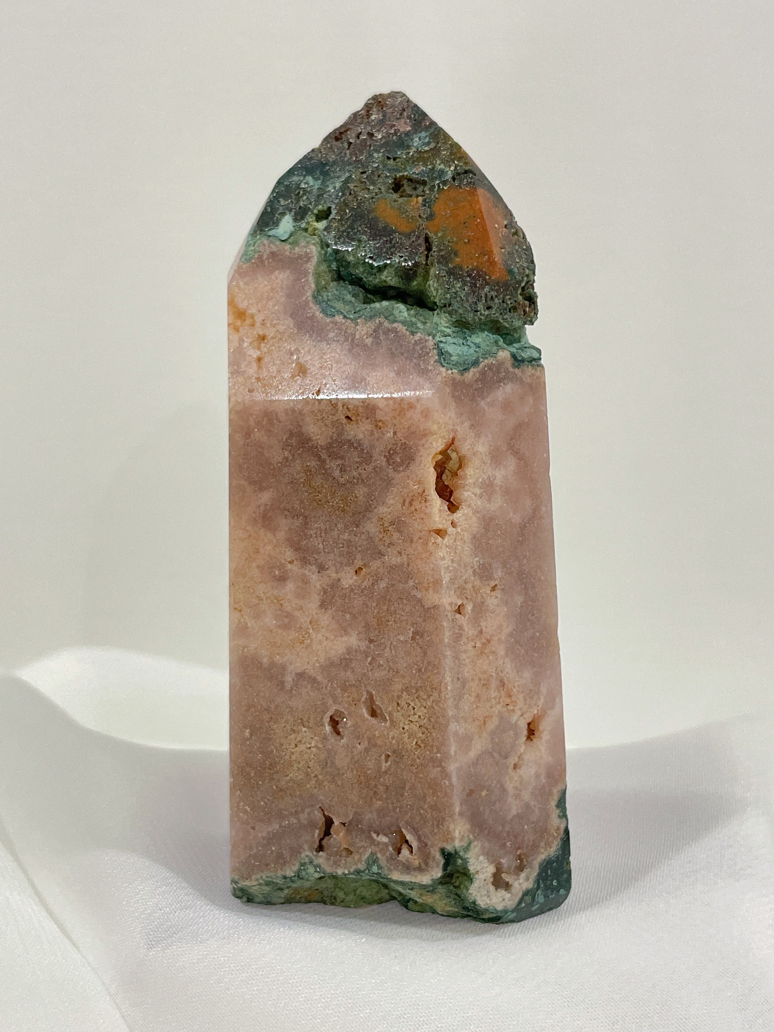 Pink amethyst crystal tower with natural moss agate accents, showcasing beautiful earthy tones and textures.