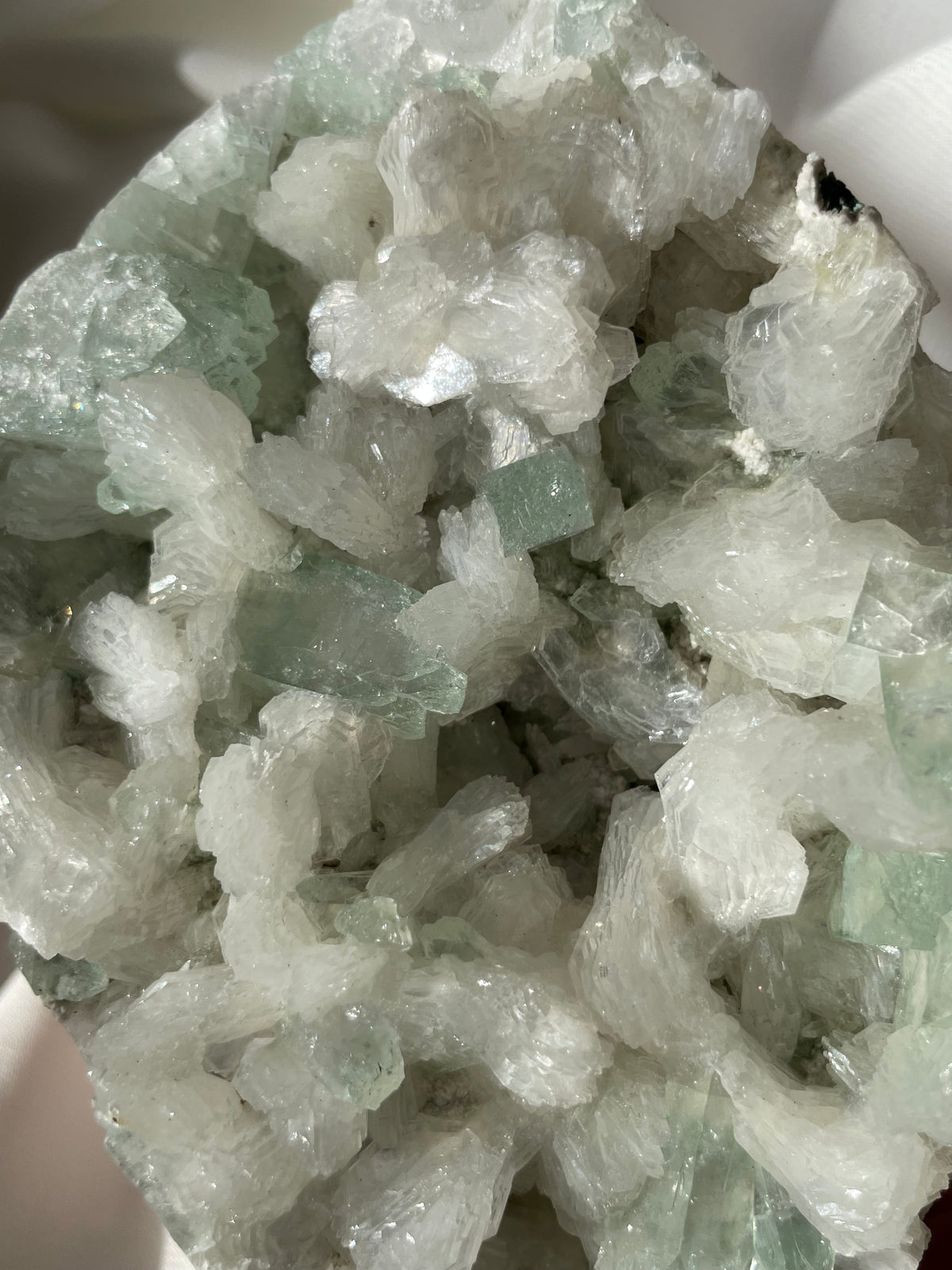 Beautiful crystal specimen featuring green apophyllite and stilbite, showcasing intricate formations and textures.