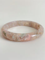Beautiful flower agate bangle with soft pink hues and natural patterns, showcasing its unique crystal design.