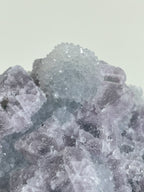 Beautiful crystal specimen of 1KG Sugar Fluorite with a light purple hue and sparkling facets.