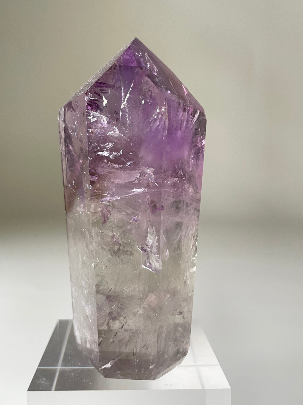 Brazilian Phantom Amethyst tower with a stunning purple hue, showcasing intricate crystal formations.