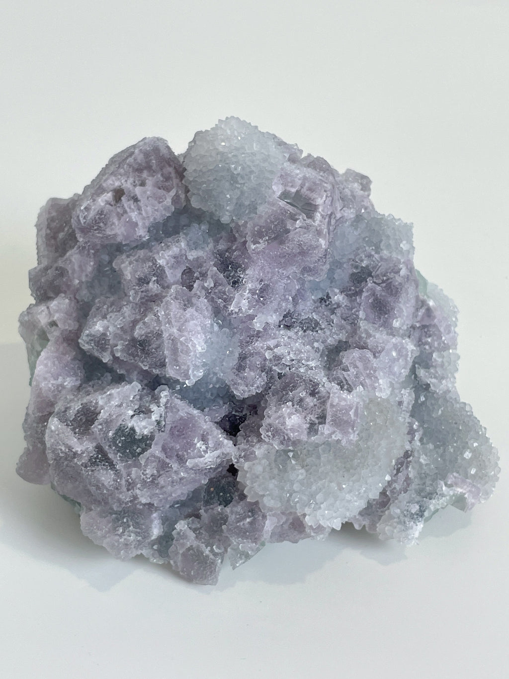 Beautiful crystal specimen of sugar fluorite with a mix of purple and clear hues, showcasing intricate formations.