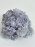 Beautiful crystal specimen of sugar fluorite with a mix of purple and clear hues, showcasing intricate formations.