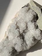 Beautiful crystal specimen featuring delicate, rounded formations with a soft, shimmering surface.