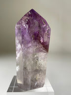 Stunning Brazilian Phantom Amethyst tower showcasing rich purple hues and intricate crystal formations.