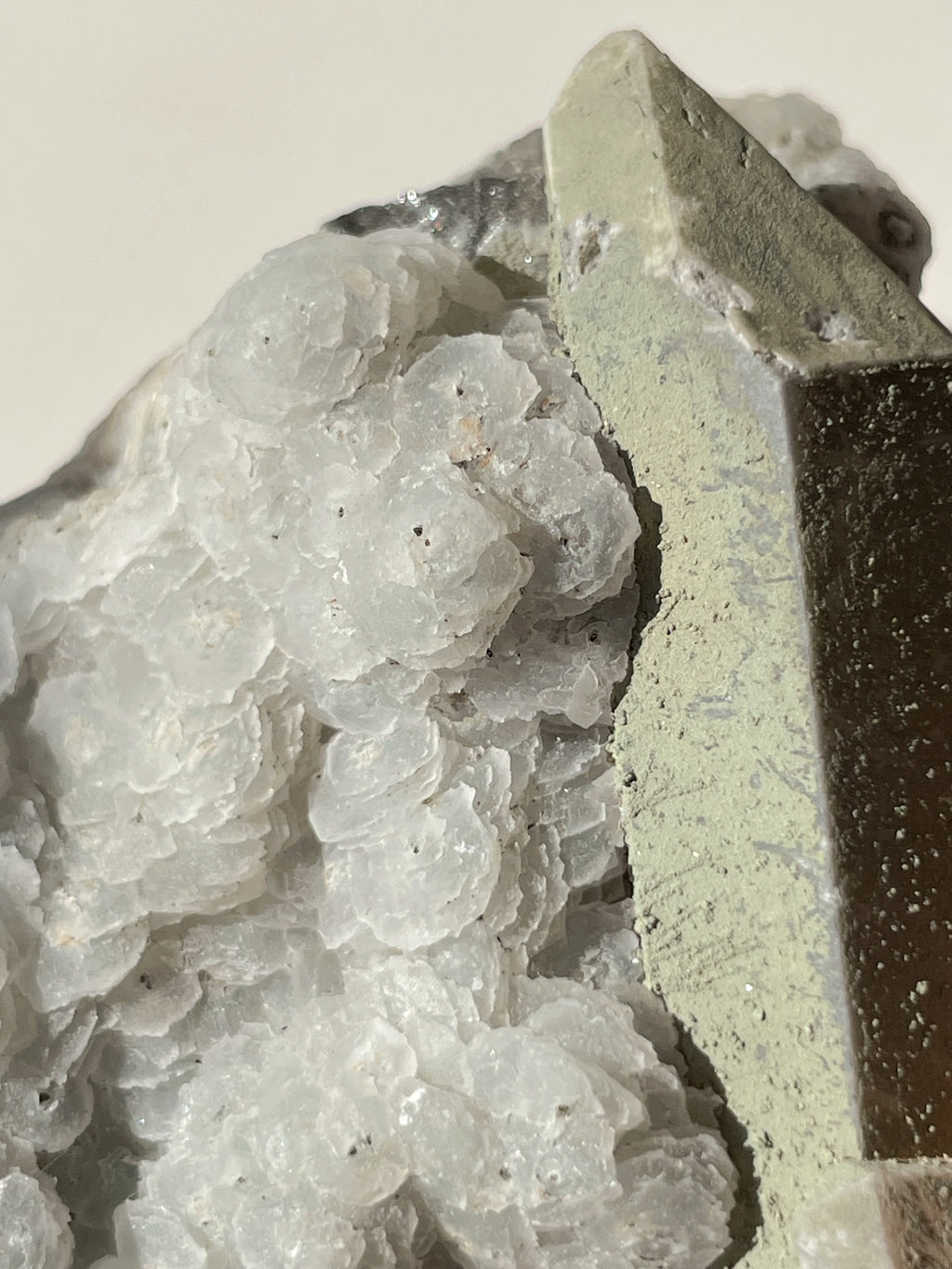Beautiful crystal specimen featuring petal calcite with pyrite on quartz, showcasing intricate textures and colors.