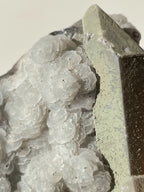 Beautiful crystal specimen featuring petal calcite with pyrite on quartz, showcasing intricate textures and colors.