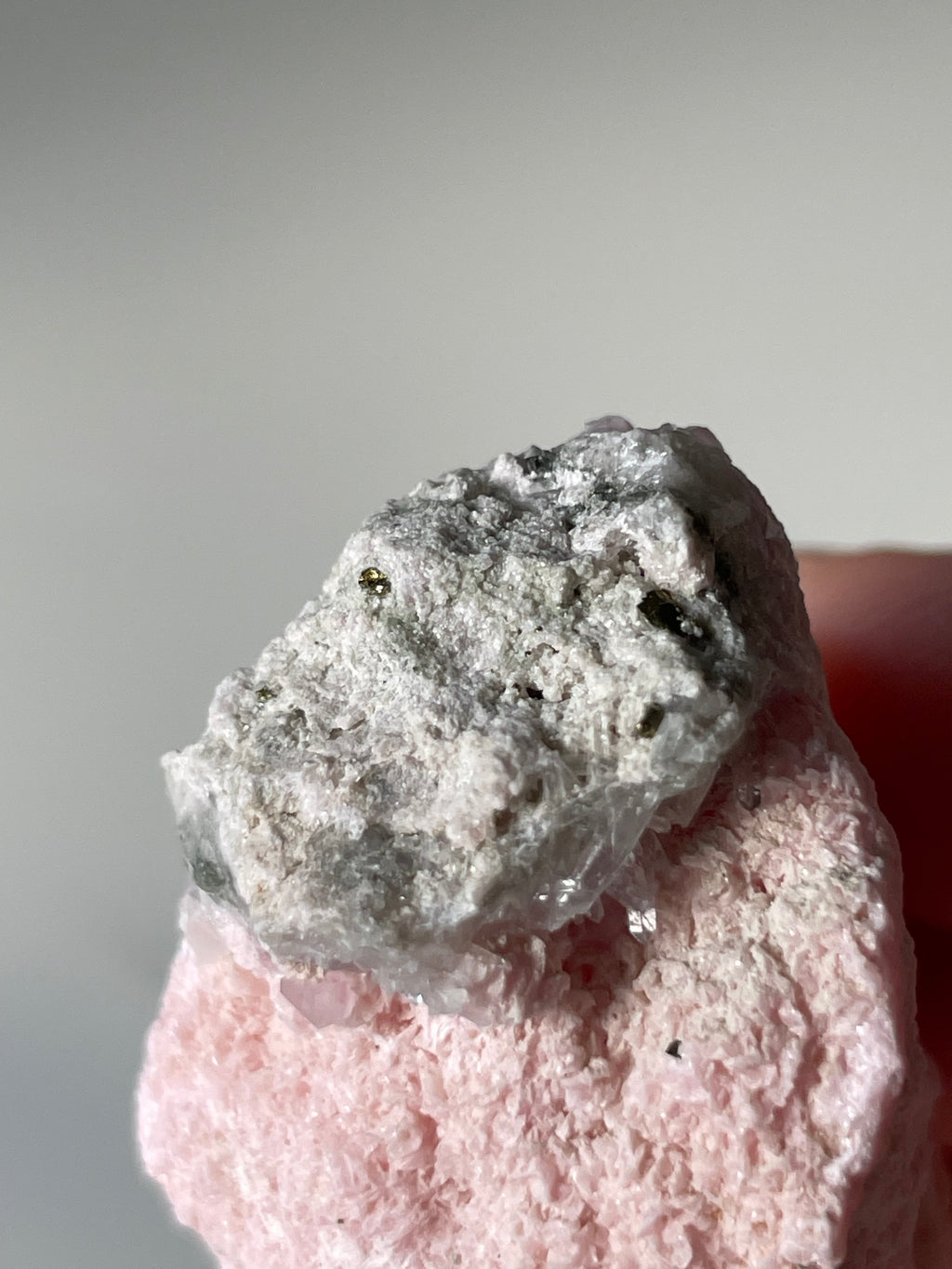 Beautiful rhodochrosite cluster showcasing soft pink hues and intricate crystal formations.