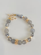 Labradorite bracelet featuring 9mm beads, accented with gold-toned spacers and a toggle clasp.