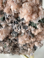 Beautiful pink calcite specimen with quartz and arsenopyrite, showcasing intricate textures and colors.