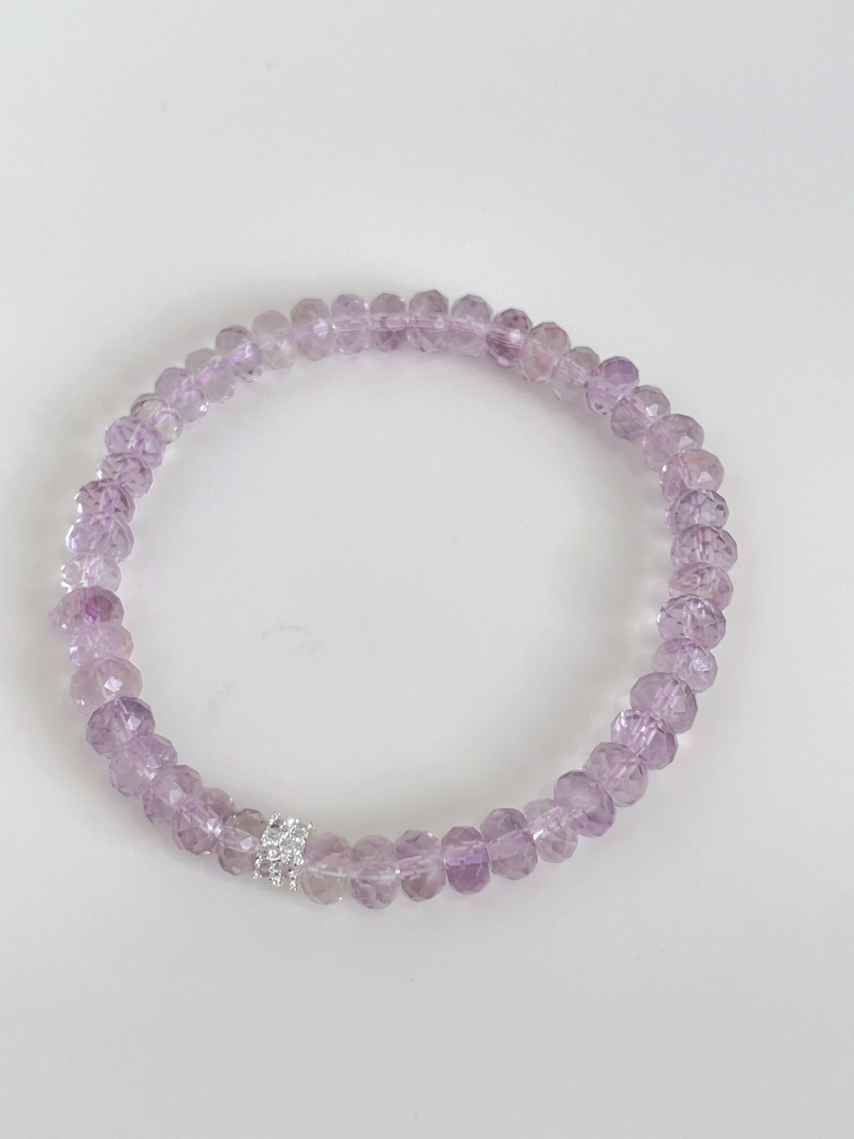 Beautiful faceted amethyst bracelet featuring 6mm beads with a sparkling accent.