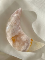 Beautiful flower agate moon with soft pink and cream hues, showcasing natural patterns and a polished finish.