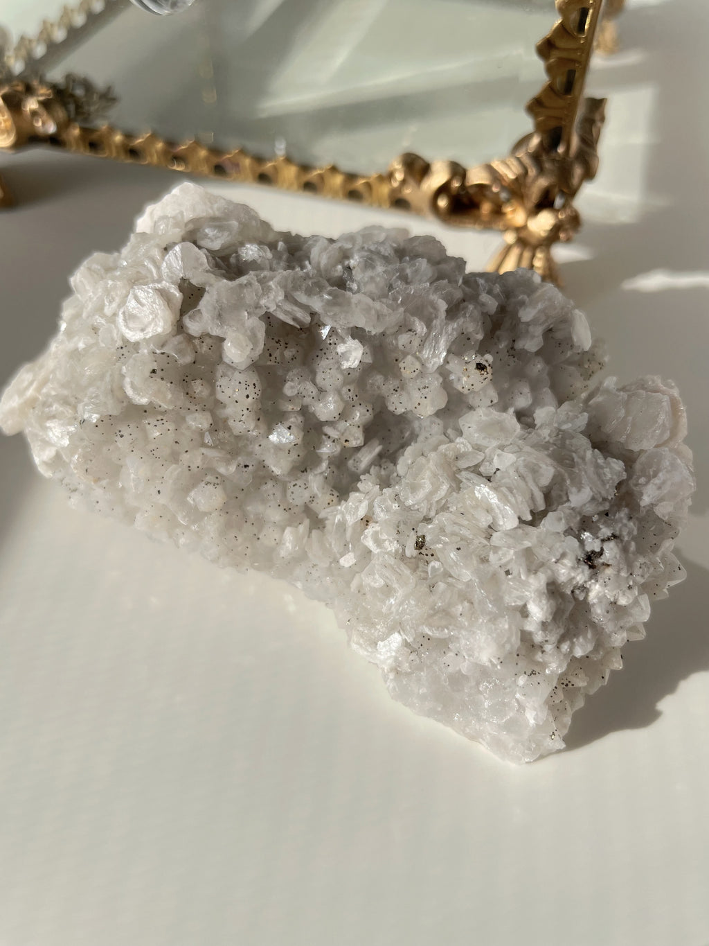 Beautiful pyrite and calcite crystal specimen on quartz, showcasing sparkling textures and natural formations.