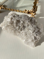 Beautiful pyrite and calcite crystal specimen on quartz, showcasing sparkling textures and natural formations.