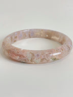 Beautiful flower agate bangle showcasing soft pink hues and unique natural patterns, perfect for stylish wear.