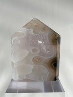 Scenic moss agate crystal tower with soft earthy tones, showcasing unique patterns and a polished finish.