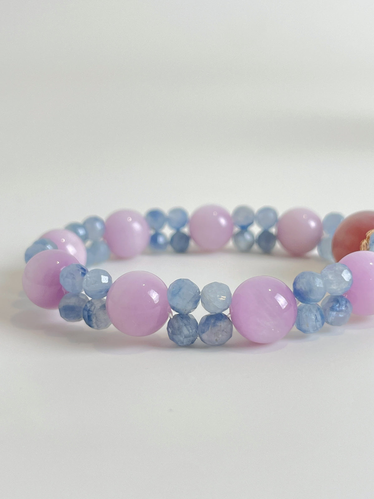 Beautiful bracelet featuring 10mm kunzite and kyanite beads in soft pink and blue hues.