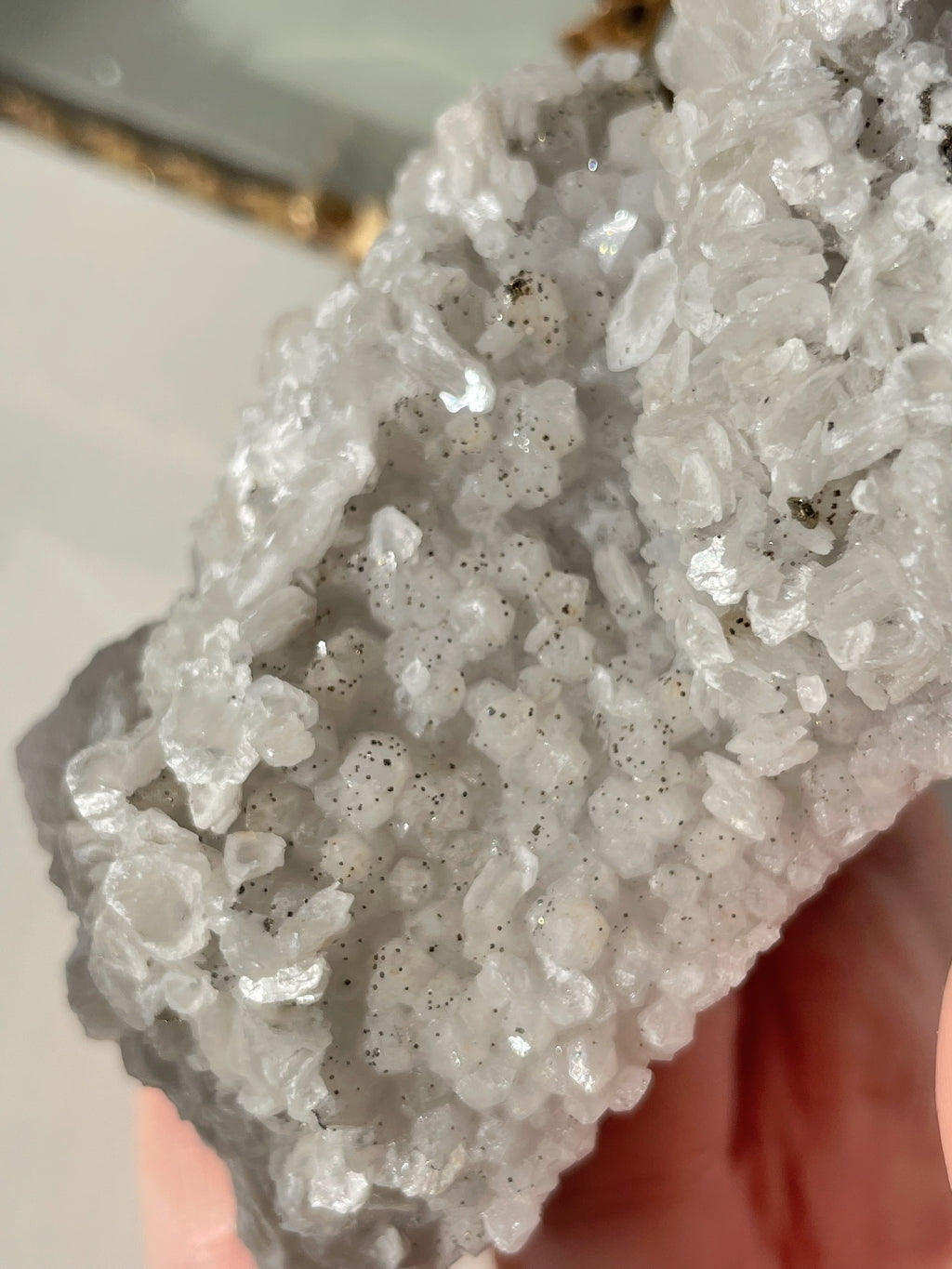 Beautiful crystal specimen featuring sparkling pyrite and calcite on quartz, showcasing natural textures and colors.