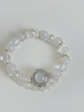 Elegant white agate bracelet featuring 10mm beads, adorned with sparkling crystal accents and a decorative centerpiece.