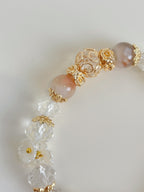 Beautiful flower agate bracelet featuring pink and clear crystal beads with decorative gold accents.