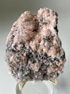 Beautiful pink calcite specimen with quartz and arsenopyrite, showcasing intricate textures and colors.