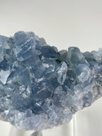 Beautiful Madagascar celestite cluster showcasing shimmering blue crystal formations.