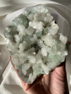 Beautiful crystal specimen featuring green apophyllite and stilbite, showcasing intricate formations and textures.