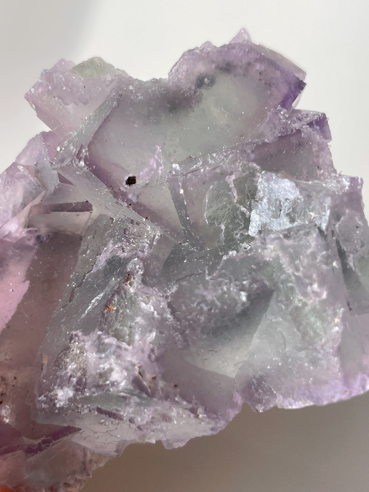 Beautiful crystal specimen of fluorite with shades of purple and green, showcasing natural formations.