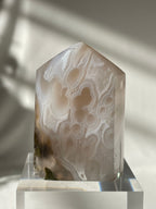 Scenic moss agate tower with smooth, polished surface showcasing unique patterns and earthy tones.