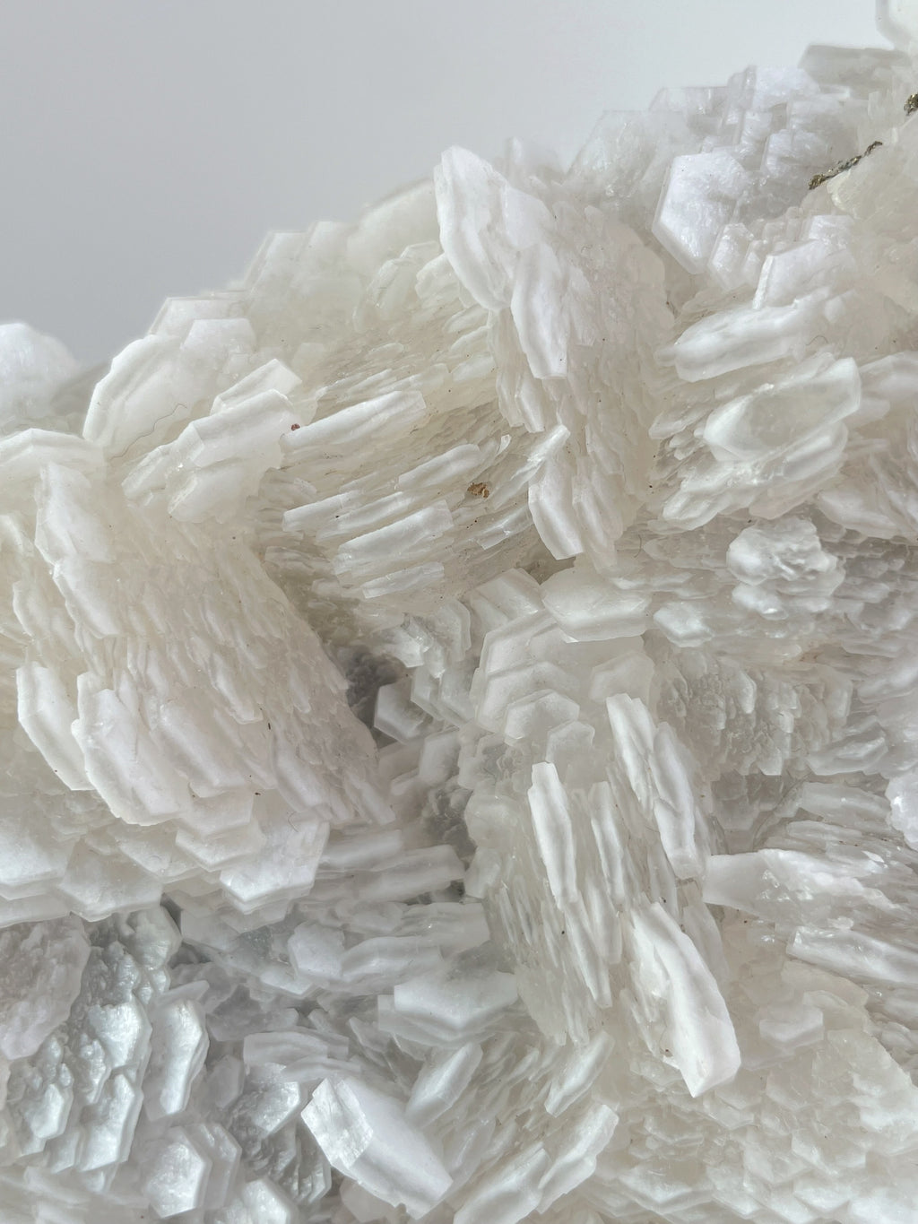 Beautiful crystal specimen featuring intricate layers of white calcite, showcasing its natural texture and shine.