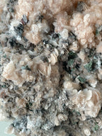 Beautiful pink calcite with quartz and arsenopyrite, showcasing intricate crystal formations and textures.