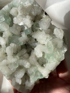 Beautiful crystal specimen featuring green apophyllite and stilbite, showcasing intricate formations and textures.