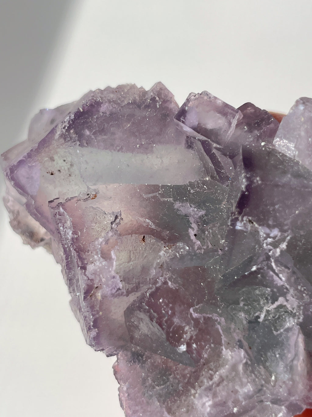 Beautiful crystal specimen of fluorite with shades of purple and clear facets, showcasing natural formations.