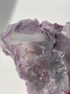 Beautiful crystal specimen of fluorite with shades of purple and clear facets, showcasing natural formations.