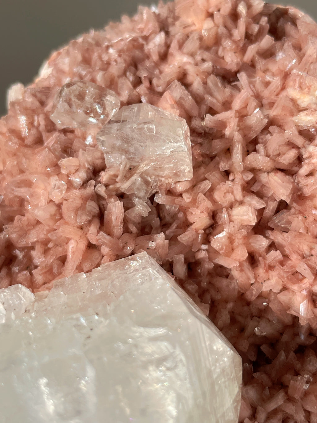 Beautiful pink Heulandite and Apophyllite crystal specimens showcasing delicate textures and colors.