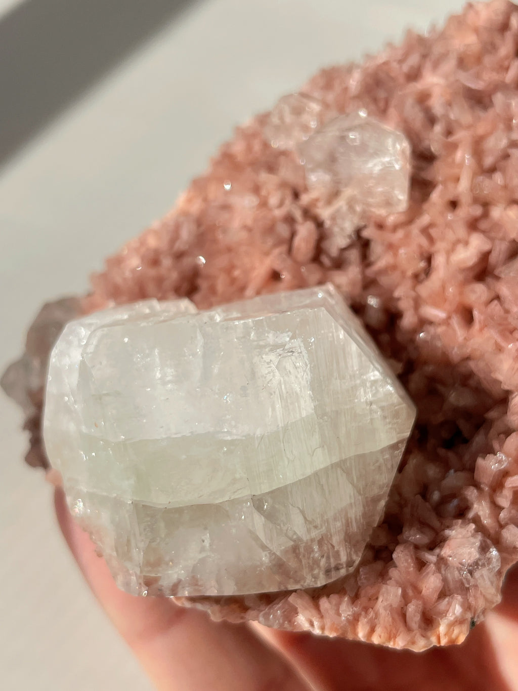 Beautiful crystal specimen featuring pink Heulandite and Apophyllite, showcasing unique layered formations.