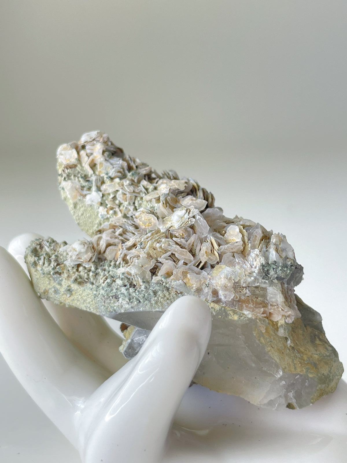 Beautiful Rosette Petal Calcite specimen on Quartz, showcasing delicate textures and natural colors.