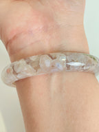 Beautiful flower agate bangle showcasing delicate floral patterns, worn on a wrist.