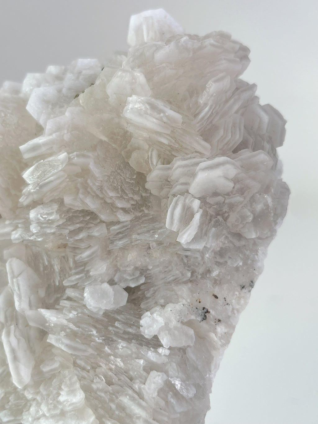 Biscuit Calcite specimen showcasing intricate crystal formations in soft, translucent hues.