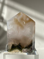 Scenic moss agate tower with earthy tones, showcasing intricate patterns and a polished finish.