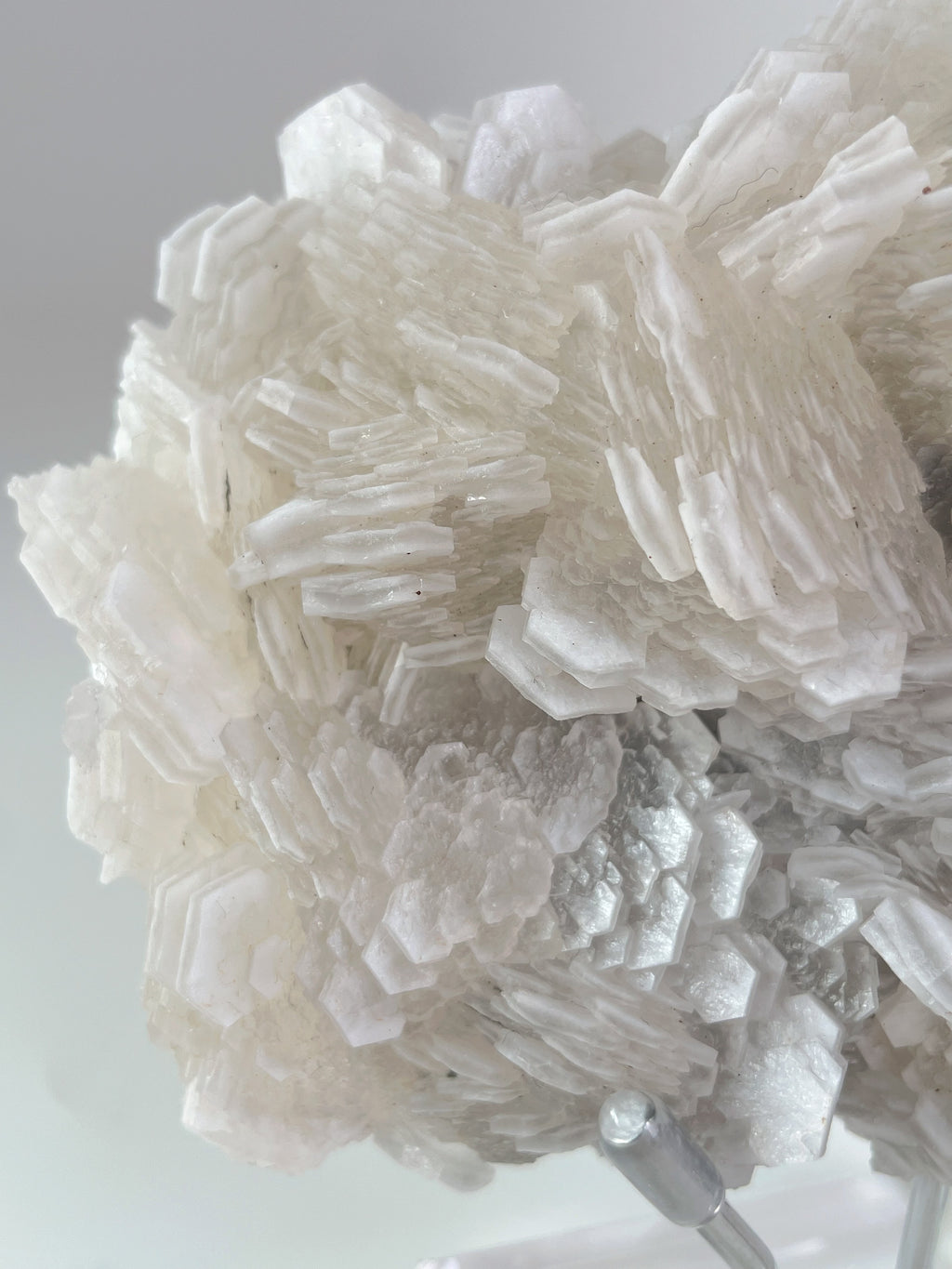 Beautiful crystal specimen featuring intricate layers and textures in a light, translucent hue.