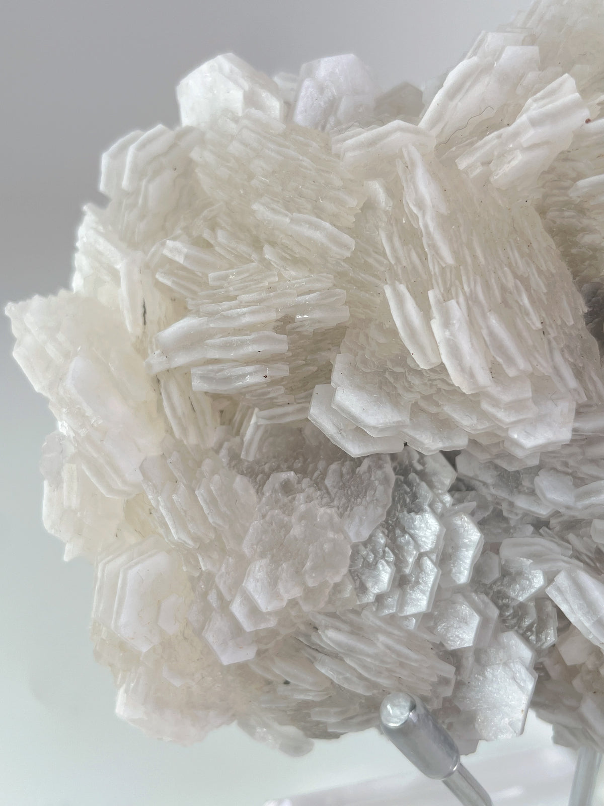 Beautiful crystal specimen featuring intricate layers and textures in a light, translucent hue.